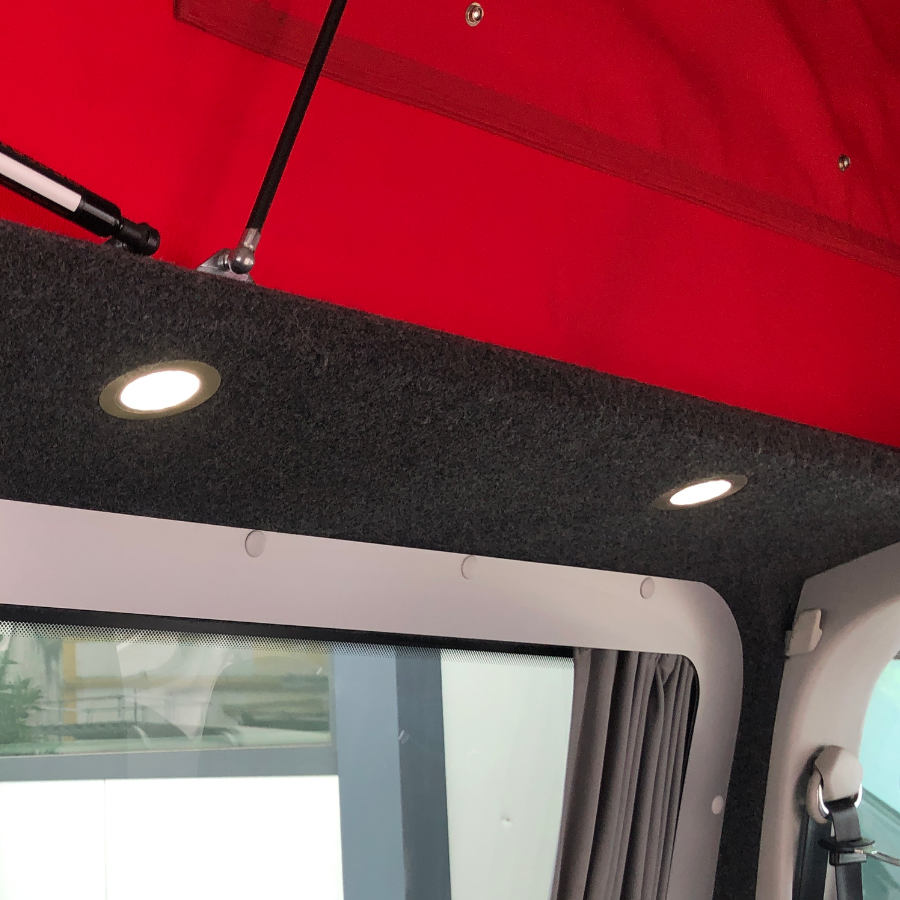 VW campervan pop up roof with red lining.